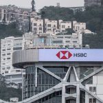 HSBC executives discussing shareholder concerns in a boardroom meeting.