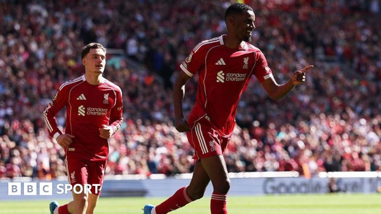 Football training session featuring Liverpool future stars Isak and Wirtz focused on teamwork.