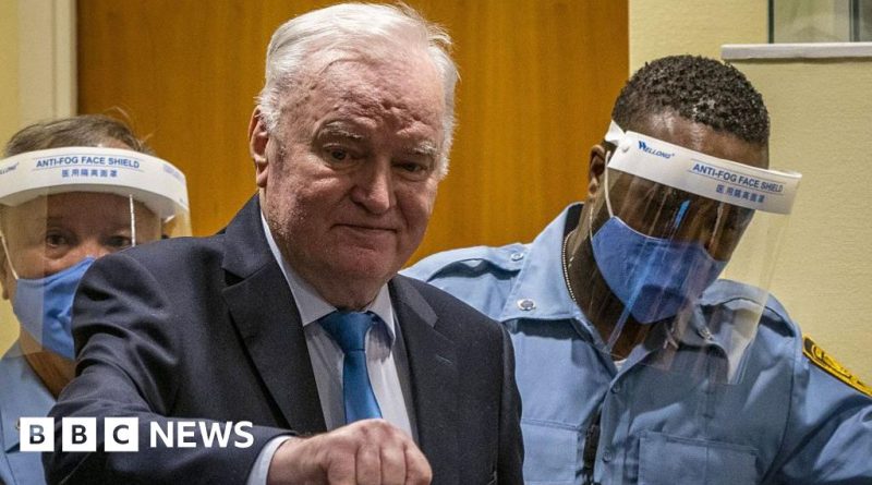 Lawyers discussing the Mladic near death release request in a courtroom.