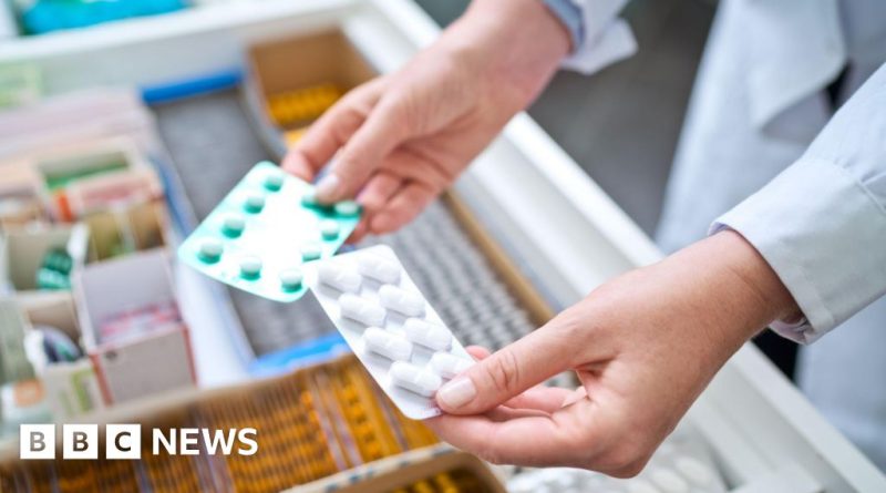 Healthcare professionals discussing medication access issues in a pharmacy.