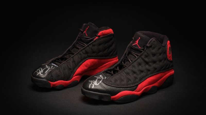 A professional auction scene showcasing Michael Jordan sneakers.