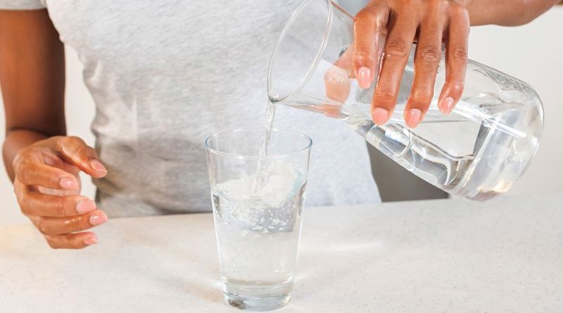 Diverse professionals discussing the effects of lithium in drinking water on autism risk.