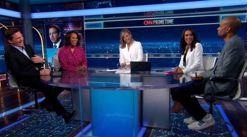 Panelists reacting humorously to DeSantis theme park threat in a meeting.