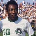 Diverse soccer fans enjoying a match, showcasing Pelé's soccer impact.