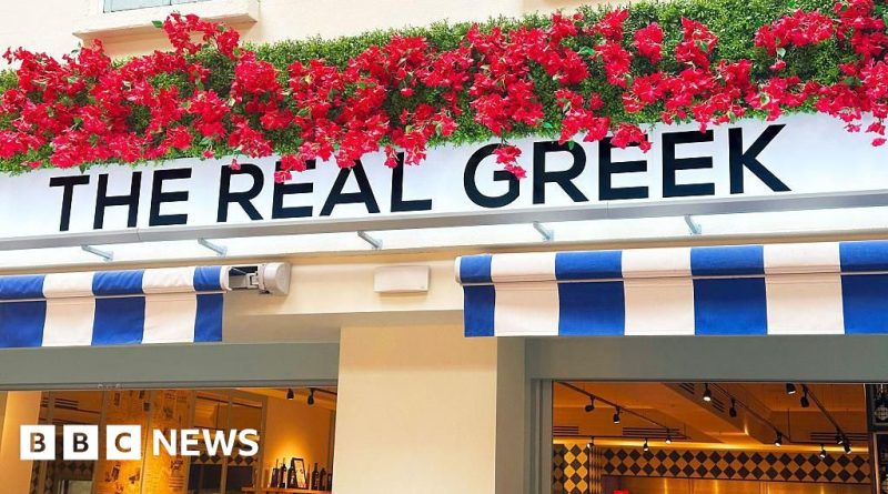 Concerned restaurant staff discussing the Real Greek restaurant crisis.