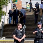Students and emergency responders in a school stabbing incident scene.