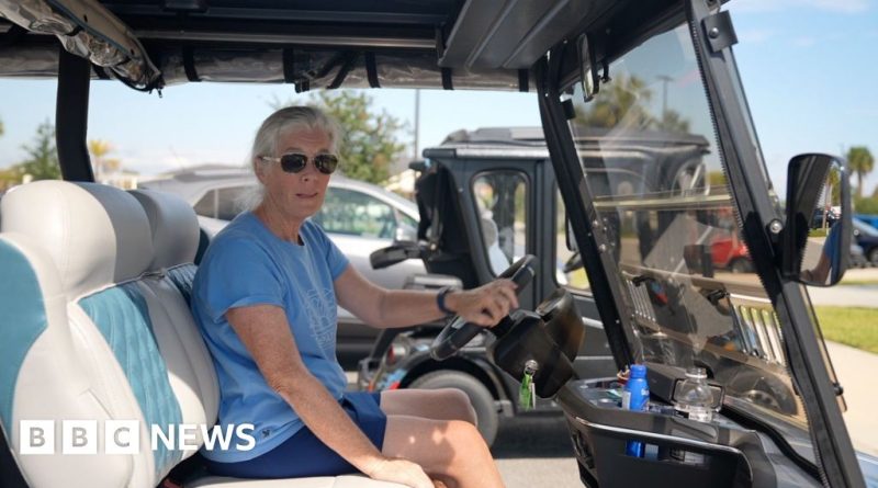 Elderly residents demonstrate in a retirement community during Trump's visit.